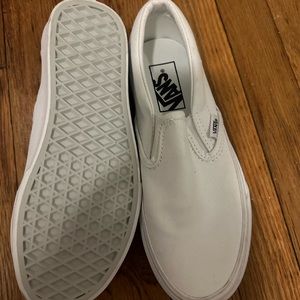 NWOT VANS white slip ons. Never worn size 4.5 men’s, 6.0 women’s